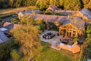 Aerial view of Oakhouse with magnificent sun room and patio garden